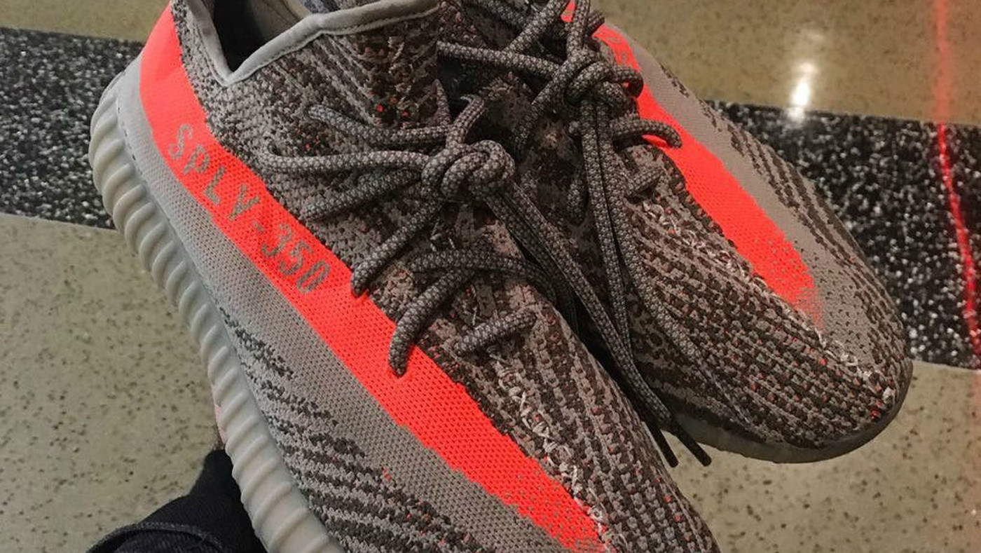 Black yeezys orange stripe clearance
