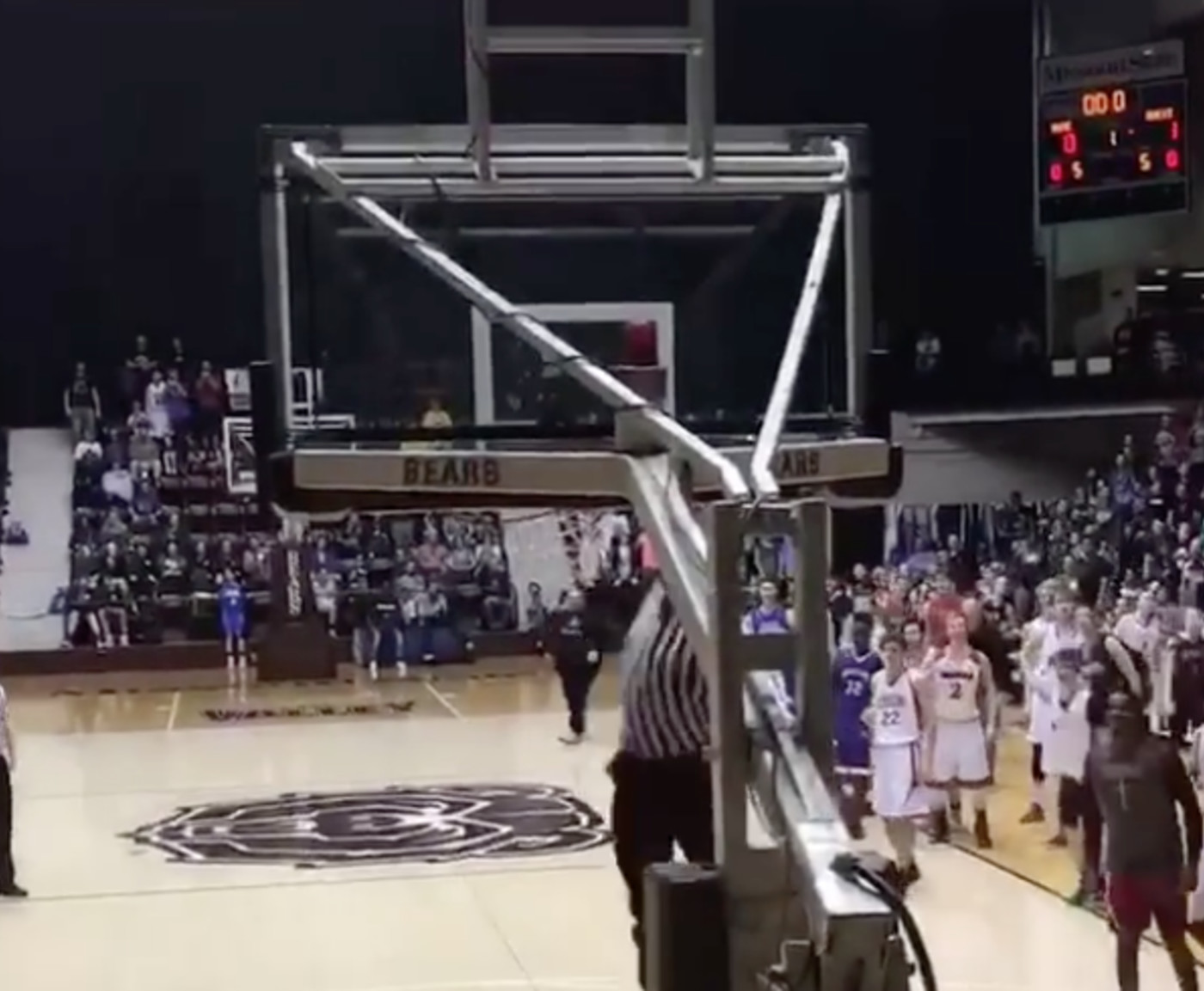 High School Basketball Referee Shuts Down Gym With Windmill Dunk