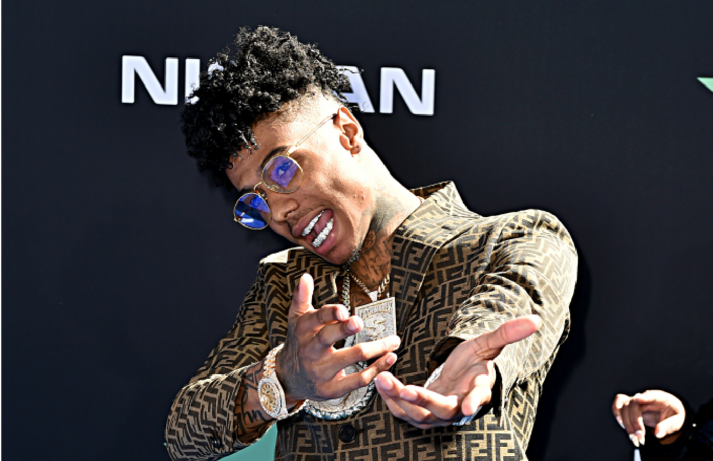 Blueface Shares Video Showing Sister Allegedly Threatening to Stab Him