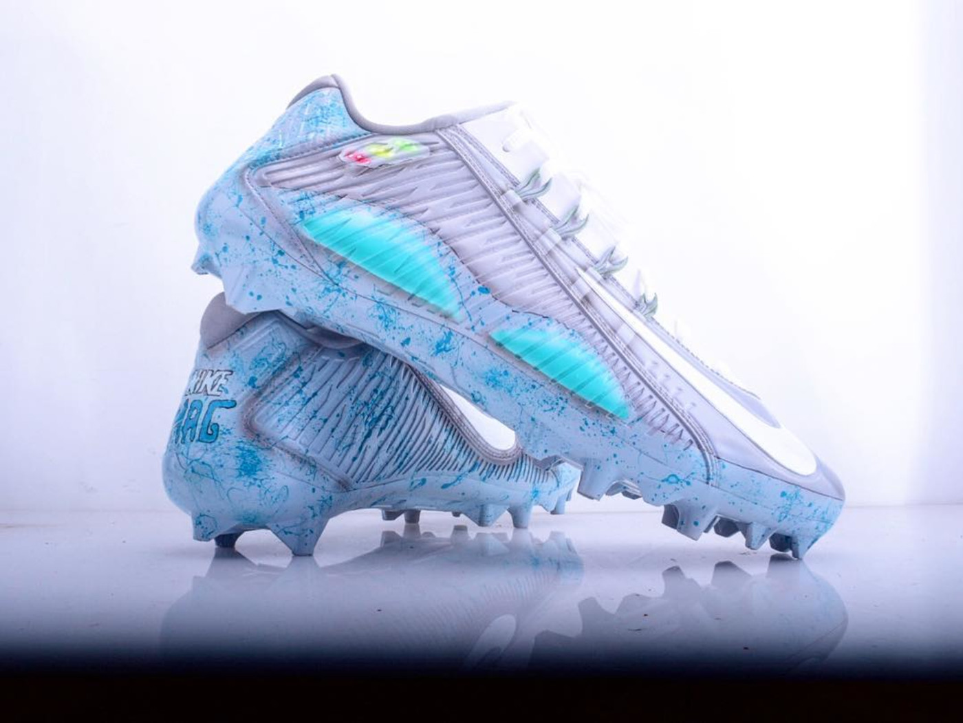 blue and green football cleats