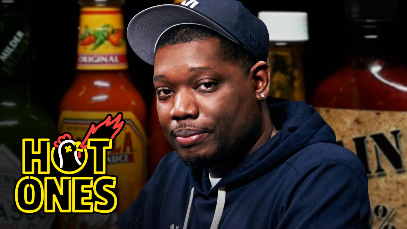 Michael Che Gs Up While Eating Spicy Wings Hot Ones Complex