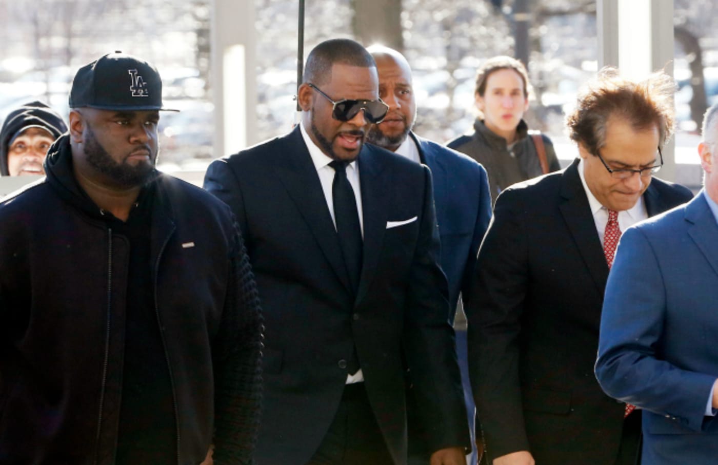 Singer R. Kelly (C) arrives for his court date