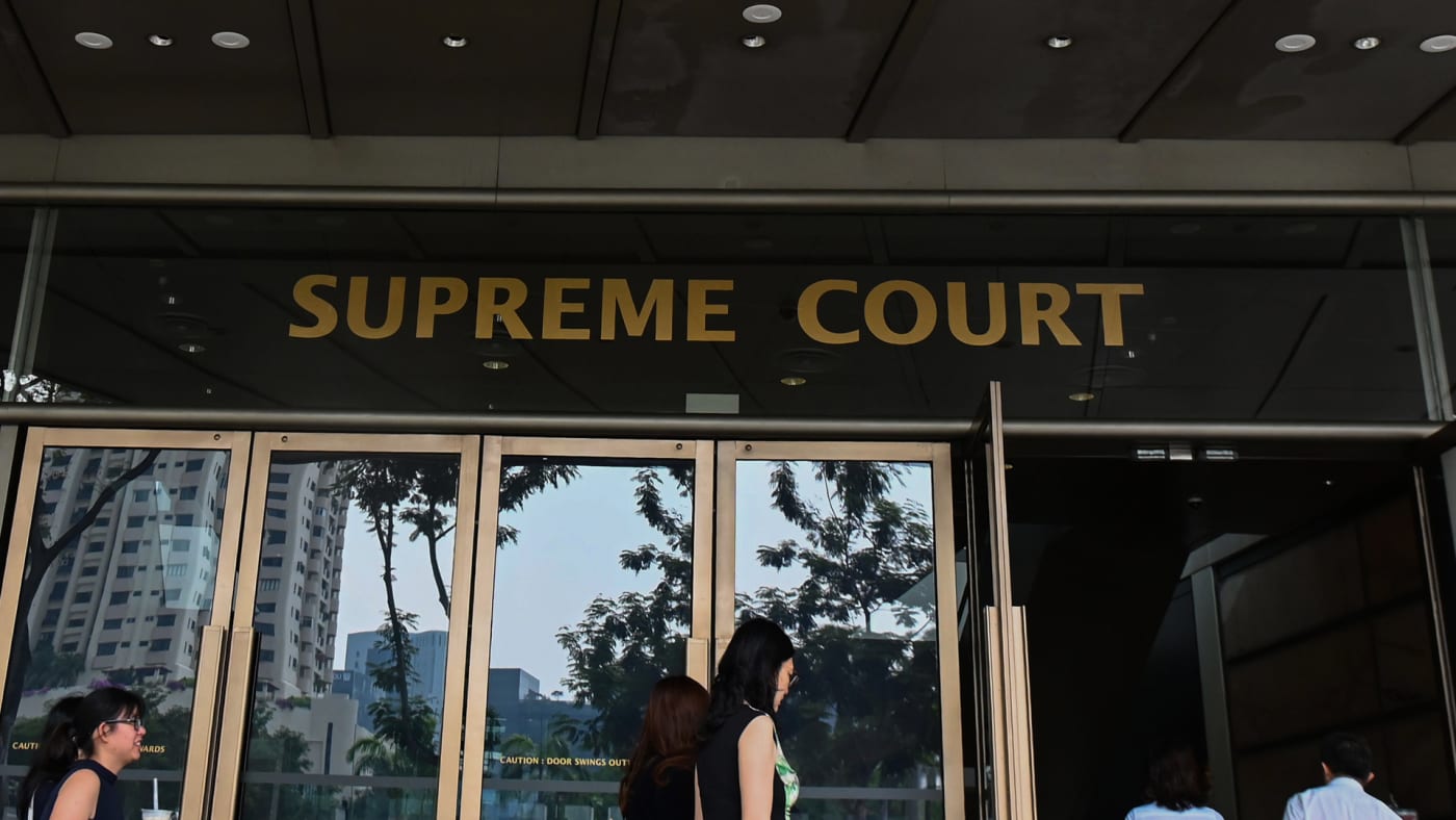 People enter the Supreme Court building in Singapore