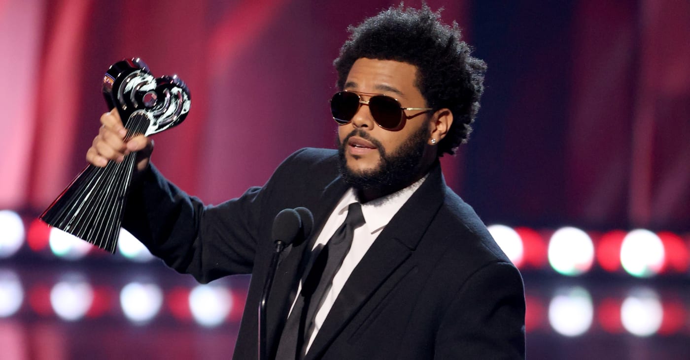 The Weeknd accepting an award at iHeartRadioMusic awards