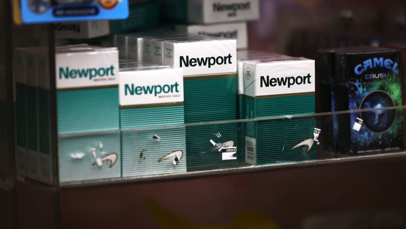 Cigarettes appear on a shelf in a store