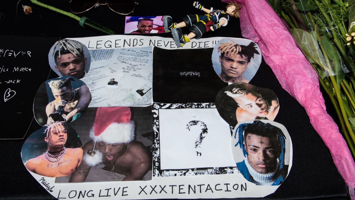 Fans leave items at a makeshift memorial outside the XXXTentacion Funeral