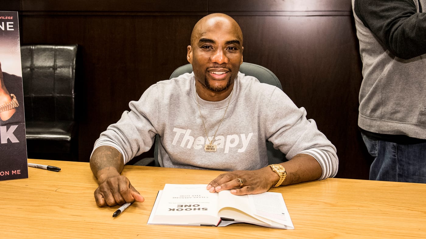 Charlamagne of 'The Breakfast Club' fame signing a book.