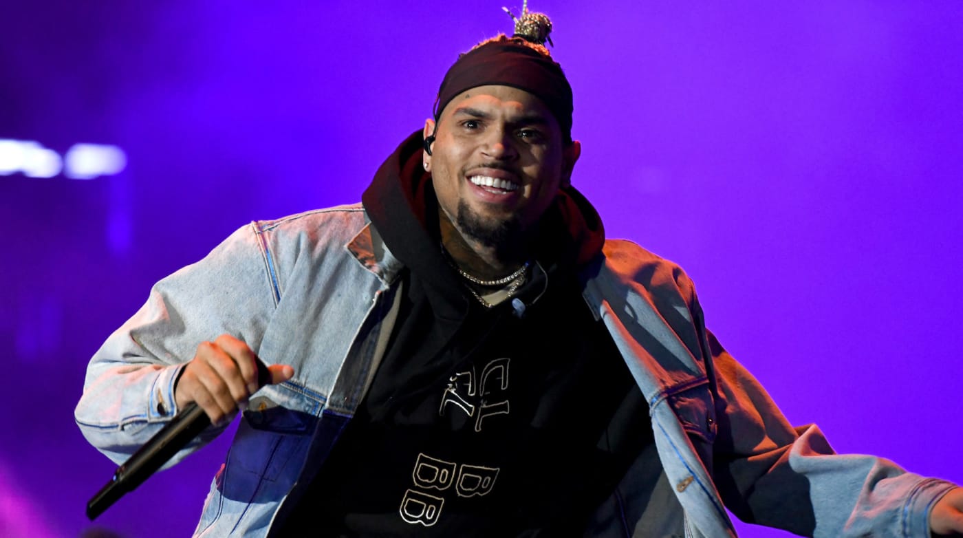 Chris Brown performing on stage in 2019 while on tour