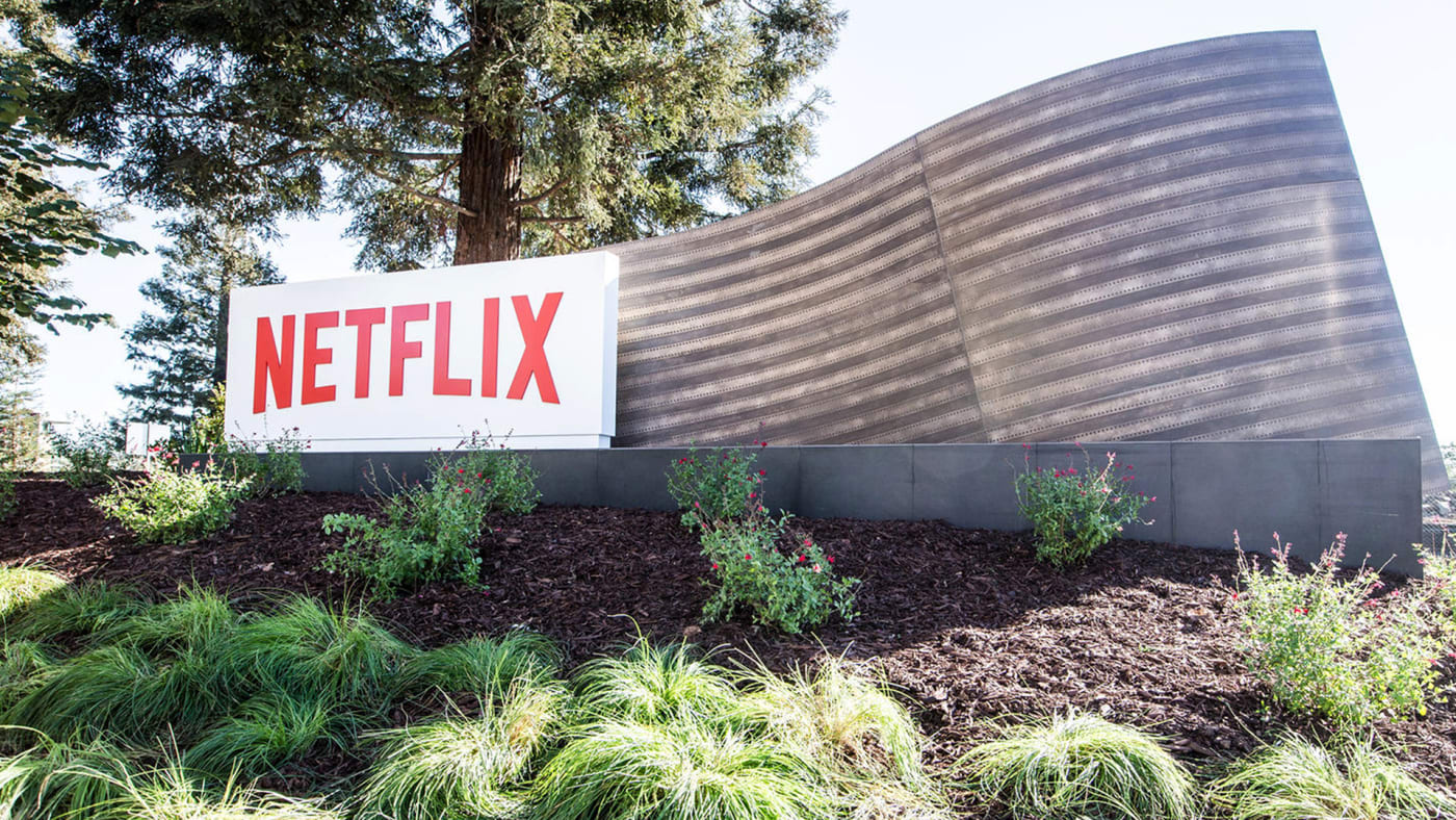 netflix shares drop to record lows