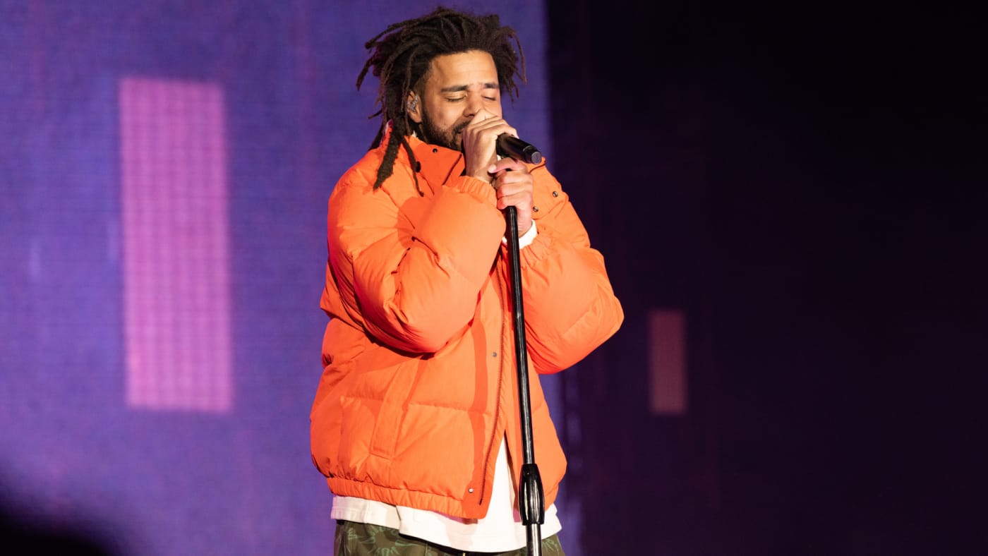 J Cole is seen performing at a festival