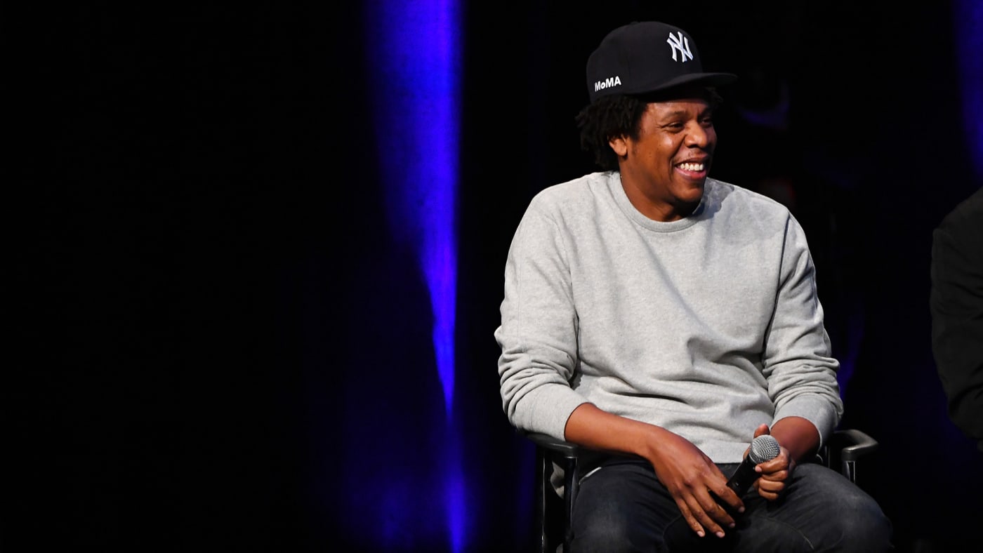 jay z sitting at a panel.
