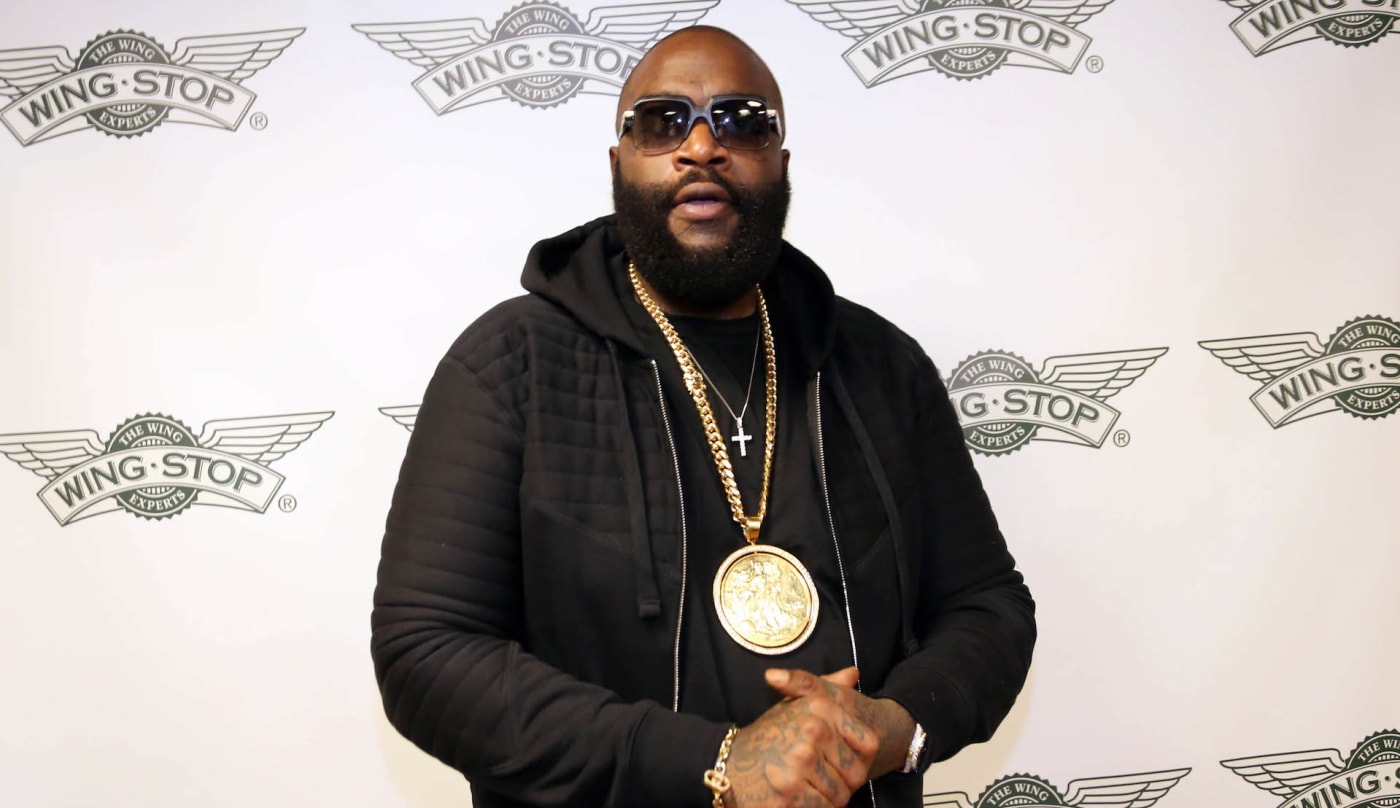 Rick Ross on red carpet at Wingstop event
