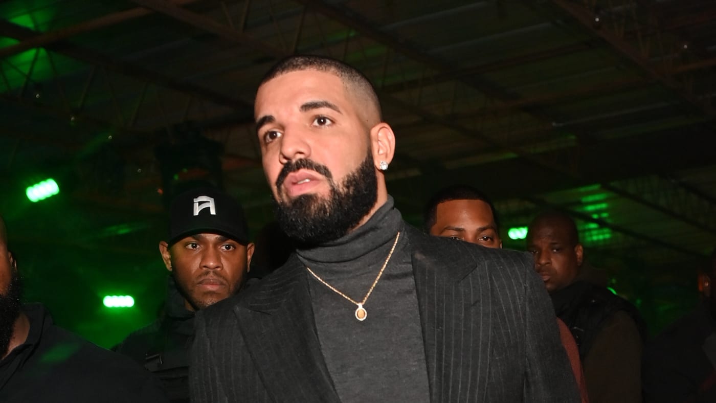 Drake is seen in a turtleneck and a blazer.