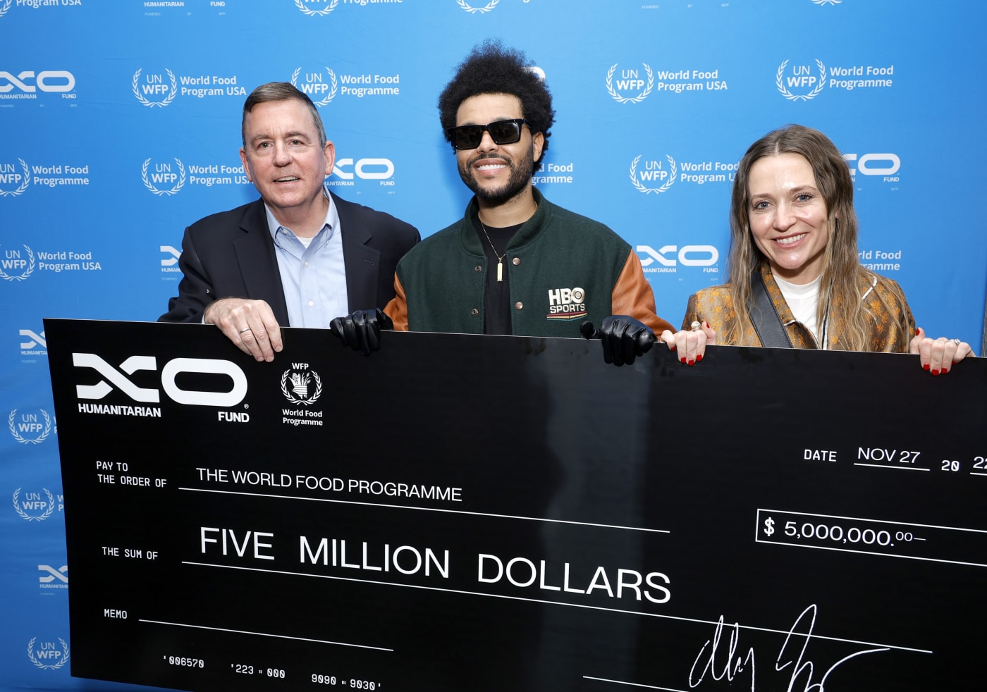 The Weeknd presents 5 million cheque