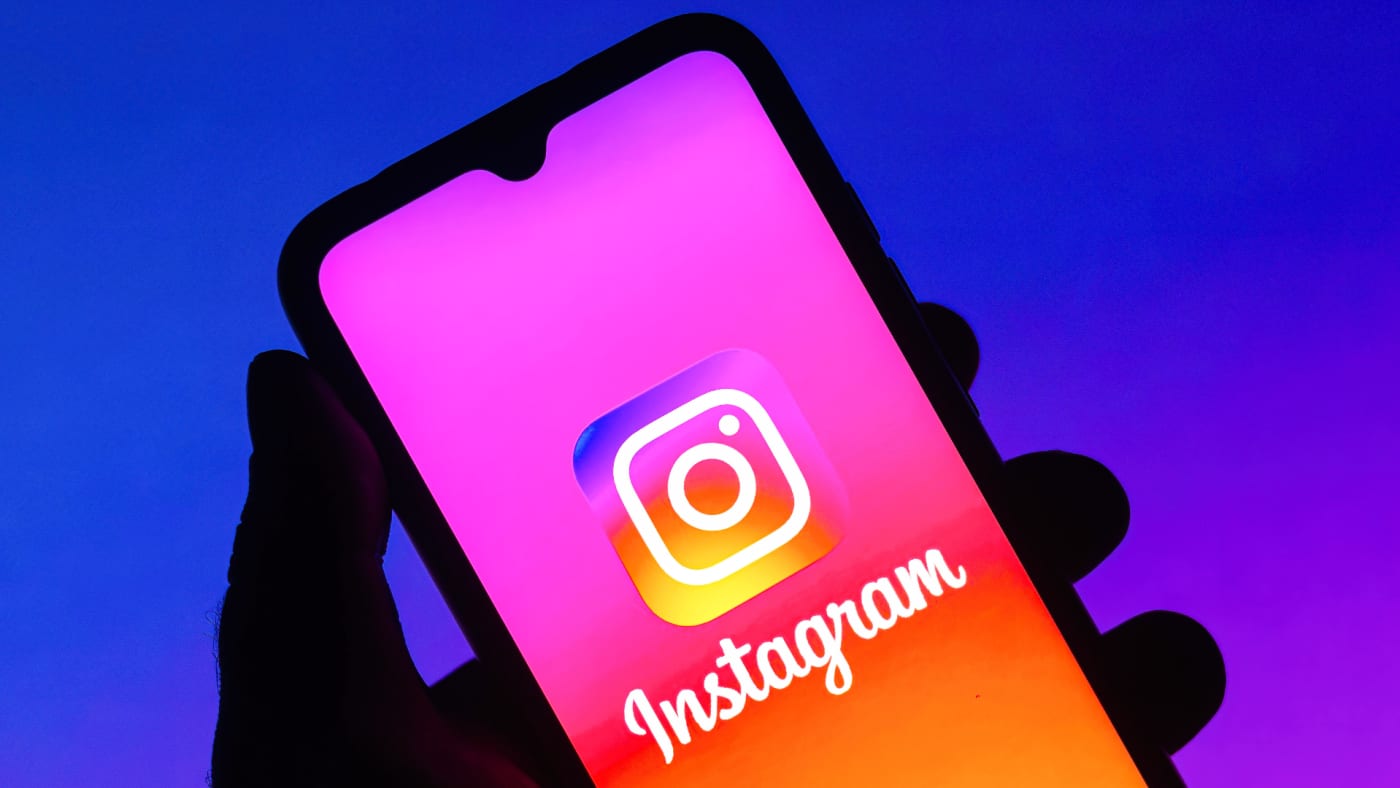 Instagram logo displayed on a smartphone.