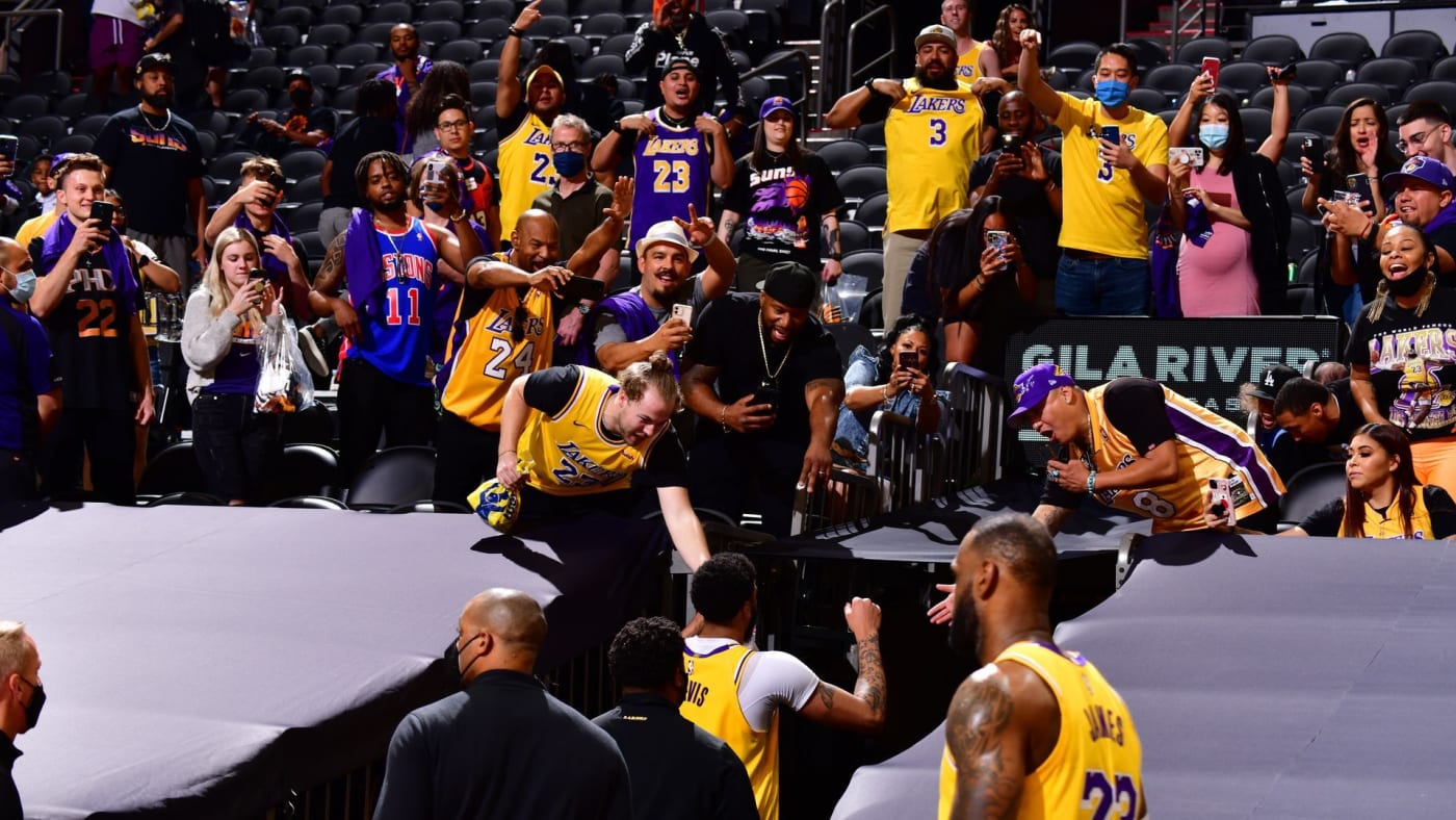 Players walk by Laker fans during 2021 NBA Playoffs