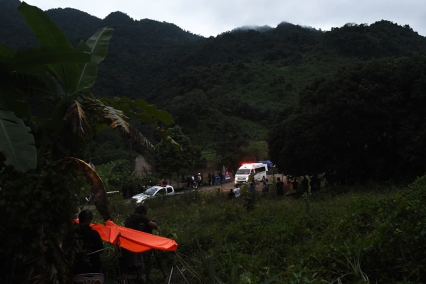 An ambulance leaves the Tham Luang cave area