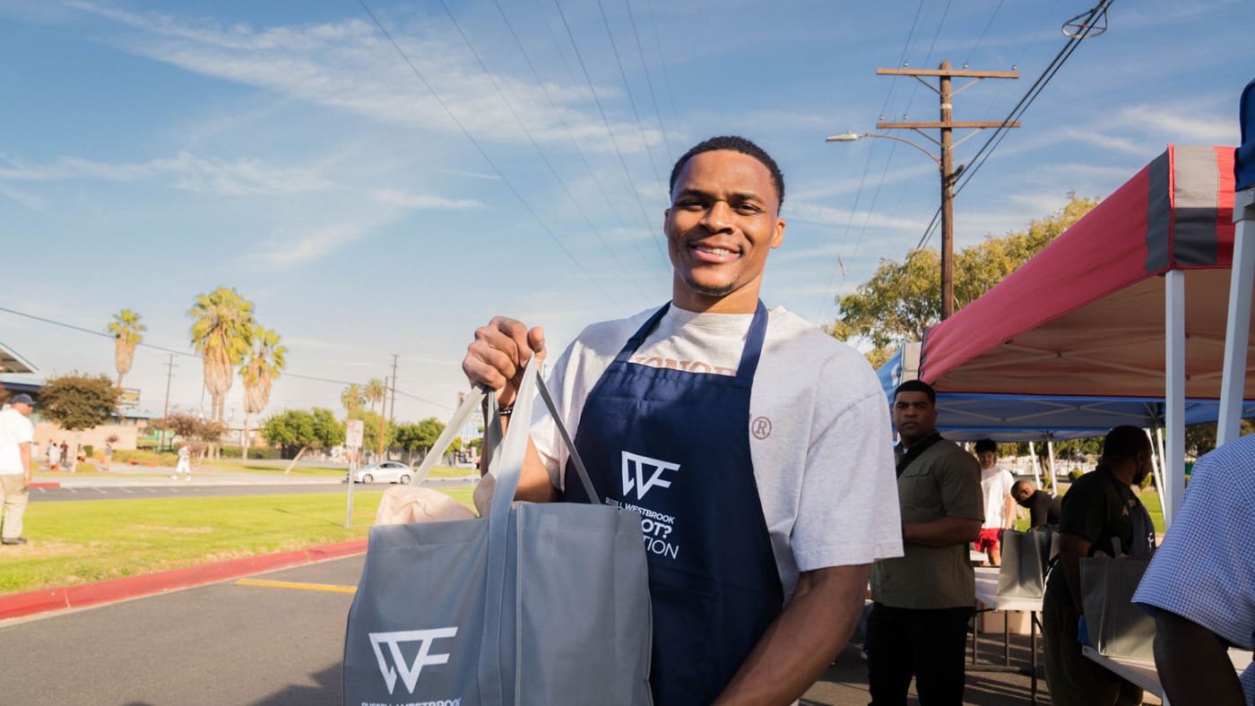 Russell Westbrook at his annual turkey drive for THanksgiving