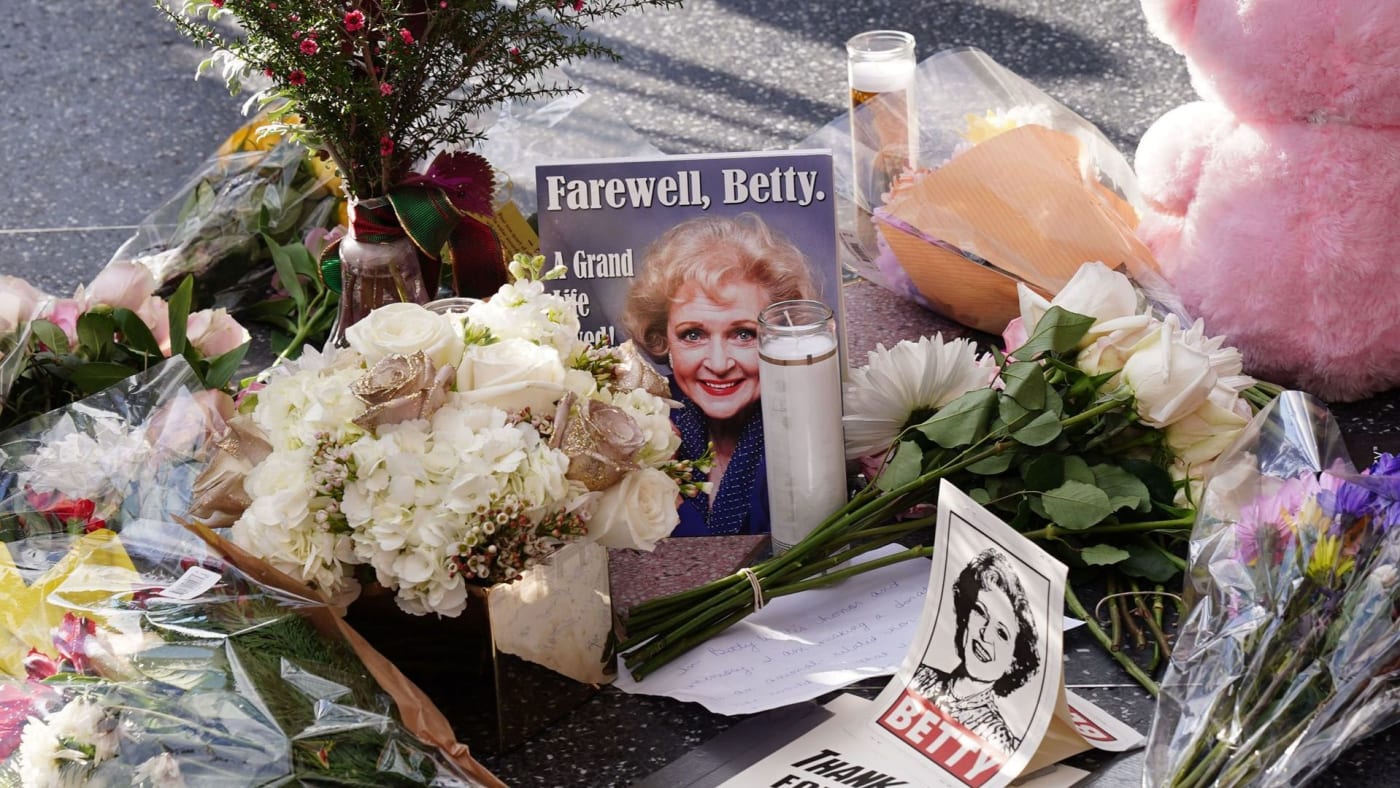Betty White's Walk of Fame star surrounded by flowers