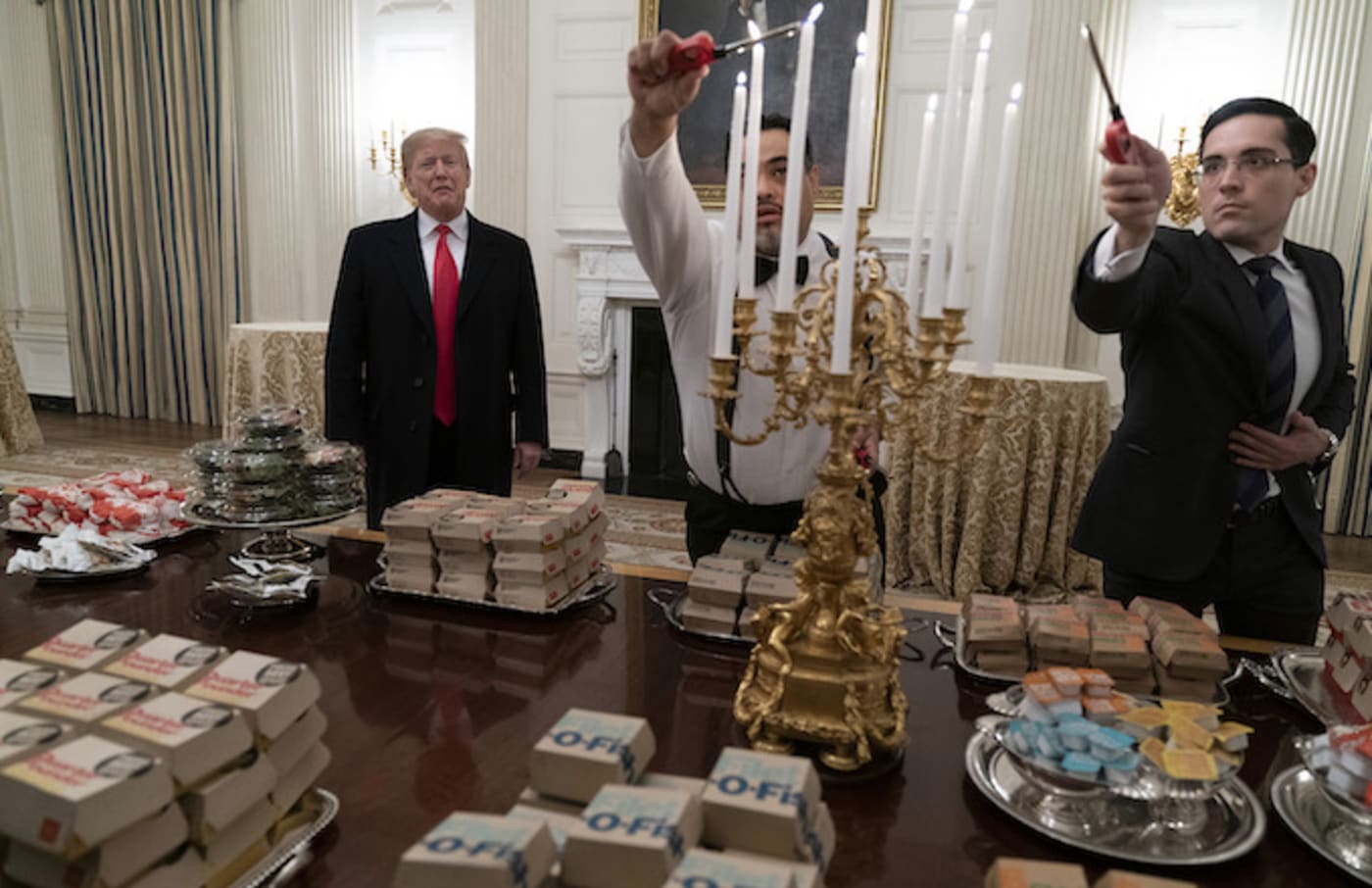 President Donald Trump presents fast food to be served to the Clemson Tigers.