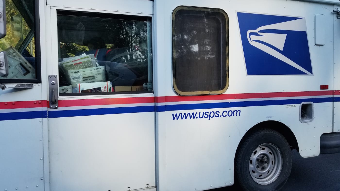 Close up of the side of a United States Postal Service (USPS) delivery truck