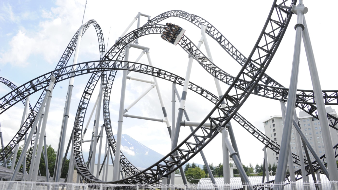 People react as they ride on Fuji-Q Highland amusement park world's steepest roller coaster "Takabisha."