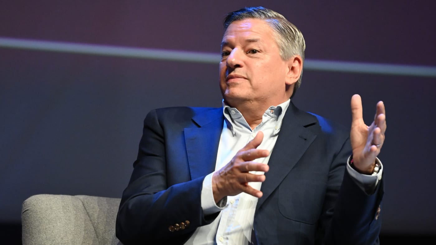 Ted Sarandos is pictured holding up his hands