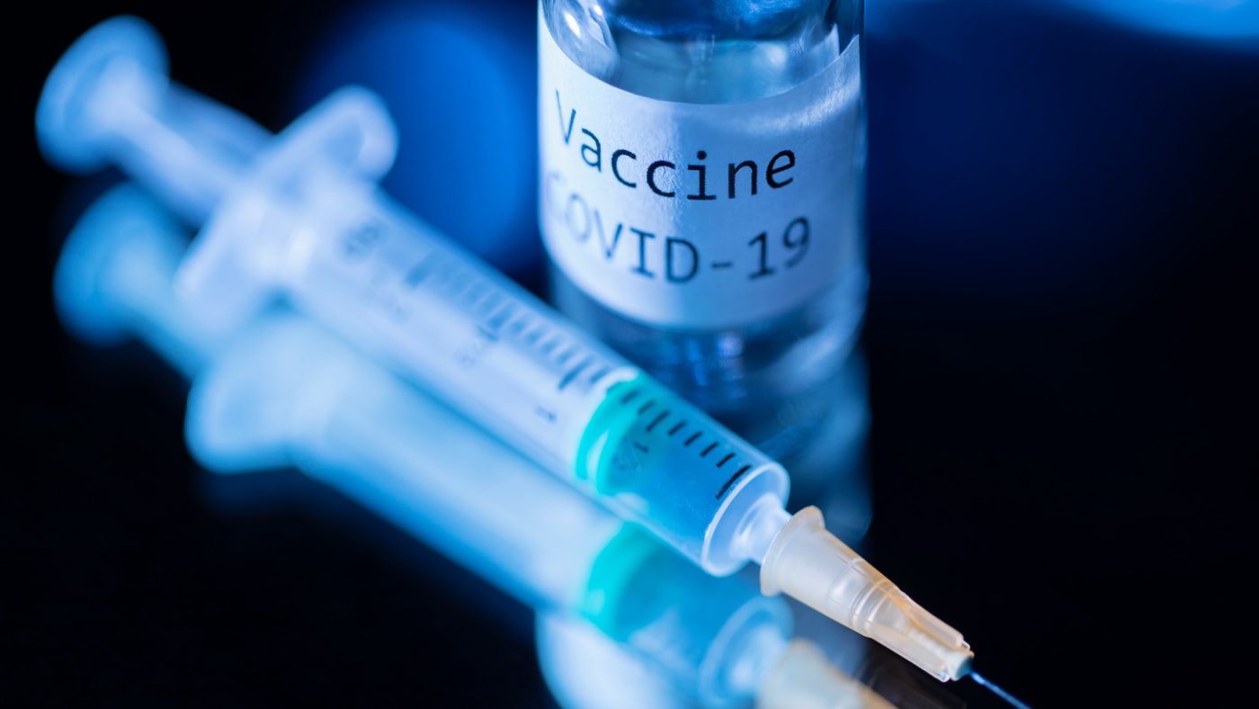 Photo of COVID 19 vaccine and needle