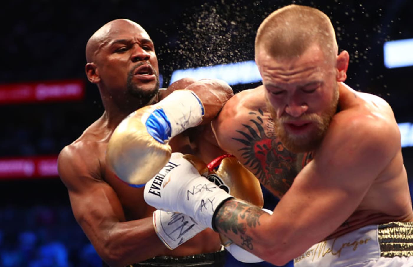 Mayweather lands a shot against Conor McGregor during their bout.