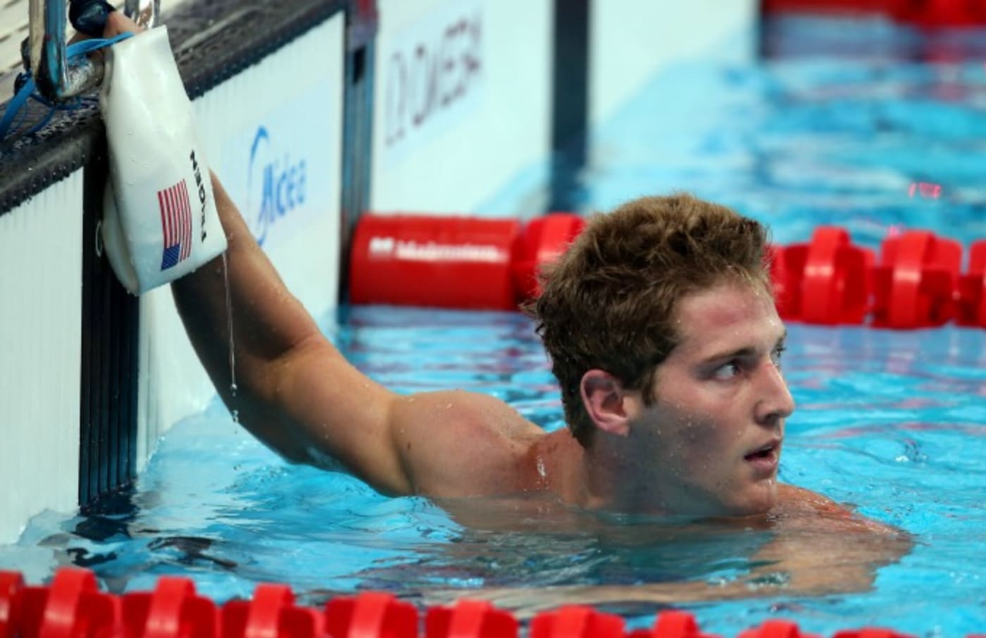 Jimmy Feigen agrees to make $11,000 donation to charity to avoid prosecution in Rio.