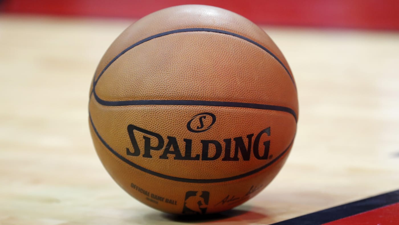 A Spalding basketball is seen on the court