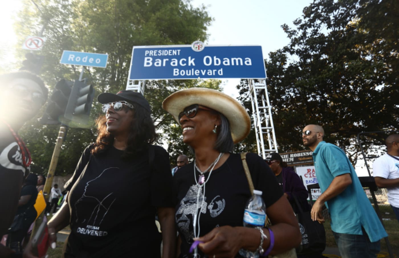 People gather at a festival where a South Los Angeles street was renamed Obama Blvd.