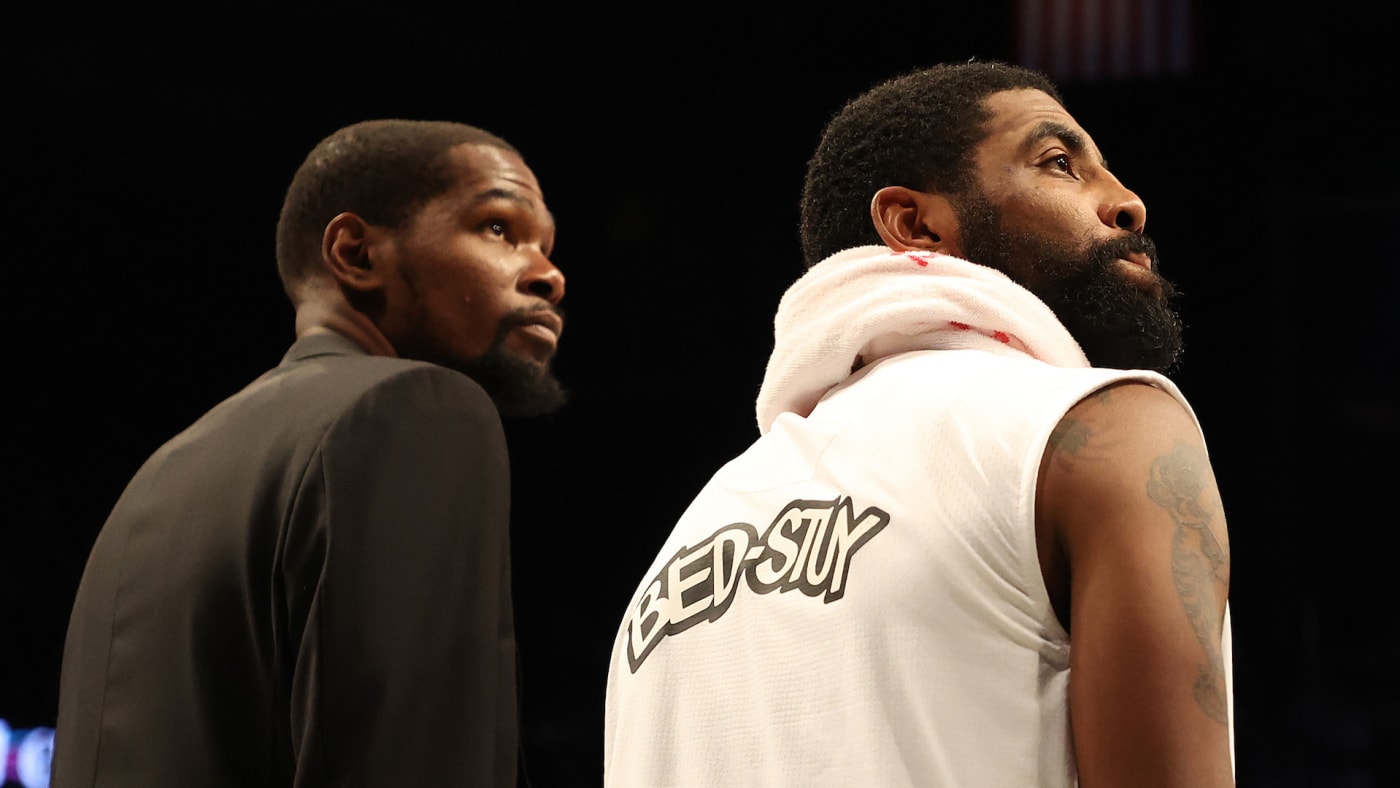 Kevin Durant and Kyrie Irving look on during their game against the Bucks.