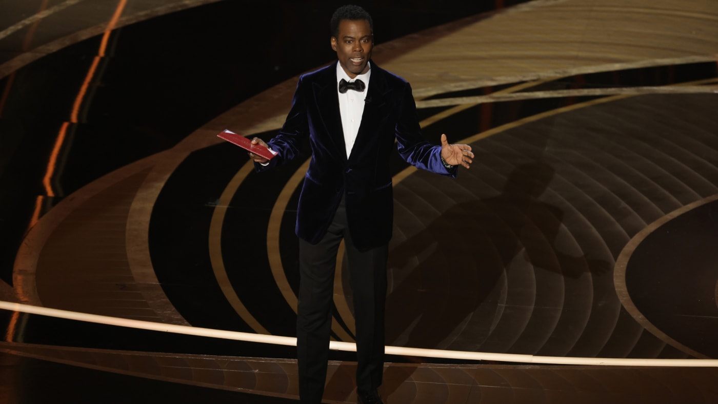 Chris Rock is seen at the Oscars presenting an award