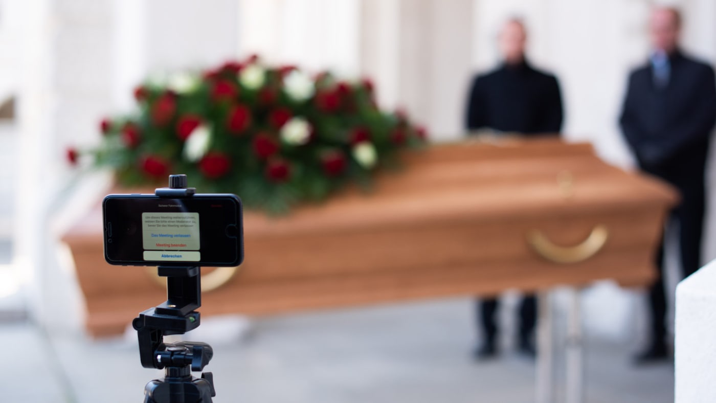 Employees of Bestattung Himmelblau undertakers rehearse livestream of upcoming funeral.