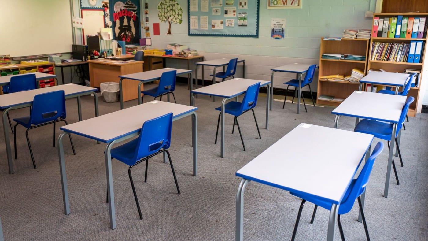 Desks are set out for social distancing at a school in England