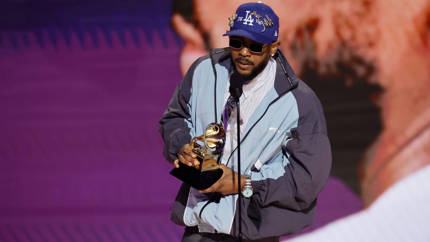 Kendrick Lamar is pictured holding a Grammys trophy