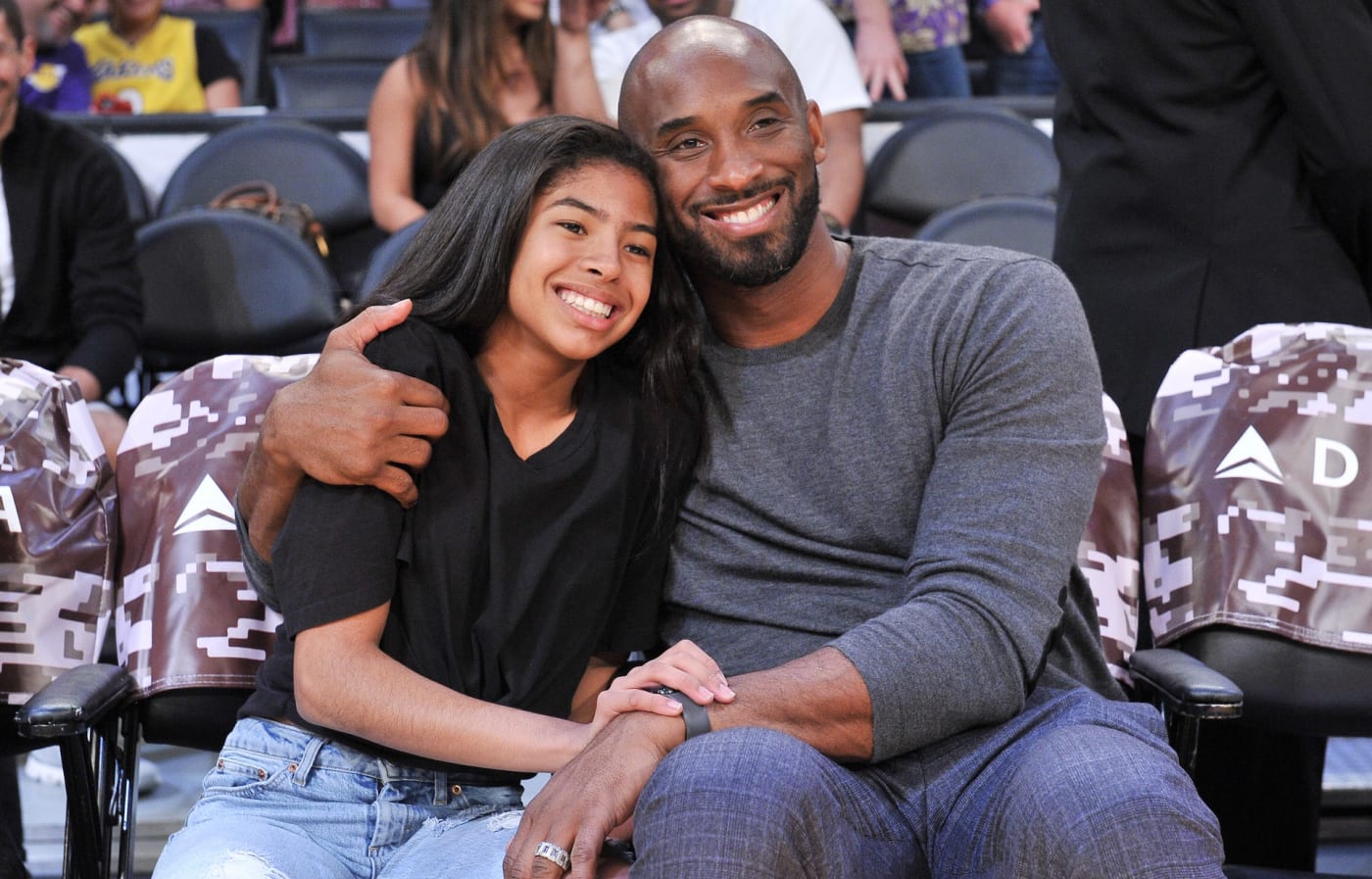 Kobe Bryant and daughter Gianna sit courtside