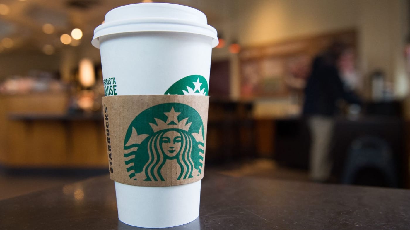 A Starbucks coffee cup is seen inside a Starbucks Coffee shop in Washington, DC