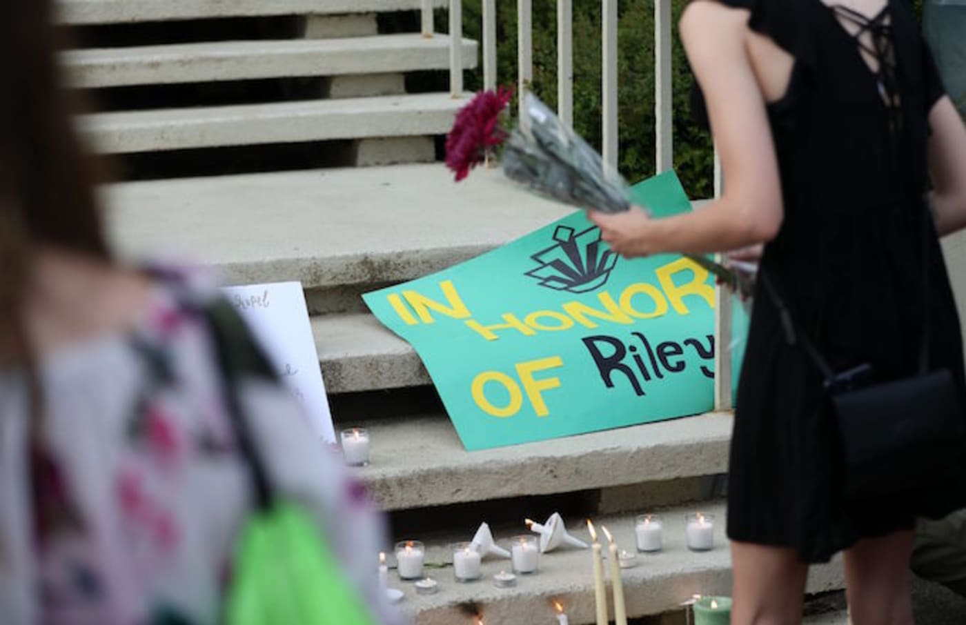 Students honor the victims of a shooting at the University of North Carolina Charlotte.