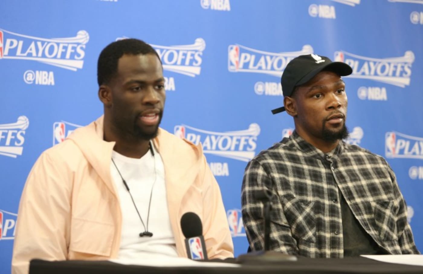 Draymond Green and Kevin Durant attend a press conference during the 2017 NBA Playoffs.