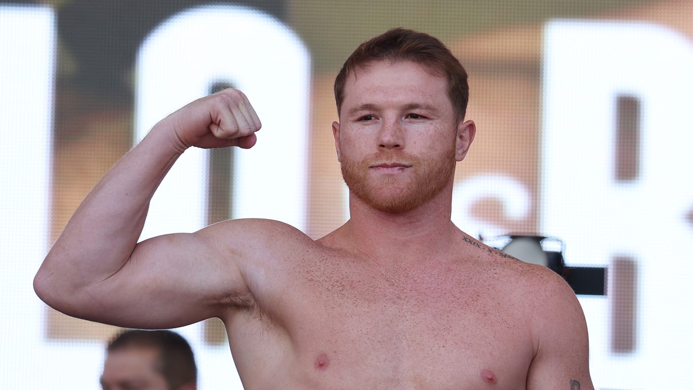 Canelo Alvarez poses on the scale during a ceremonial weighin at Toshiba Plaza