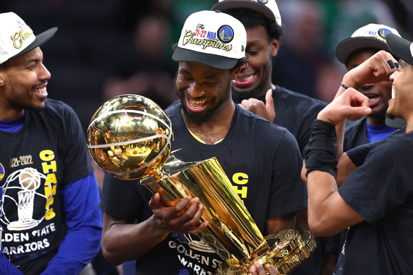 Andrew Wiggins holds the Larry O'Brien trophy