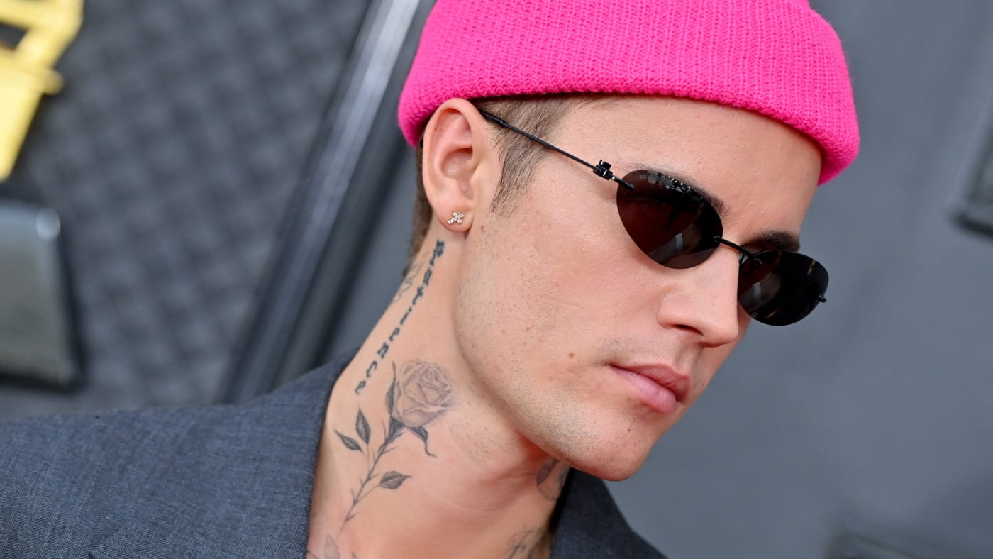 Justin Bieber is seen wearing a pink beanie
