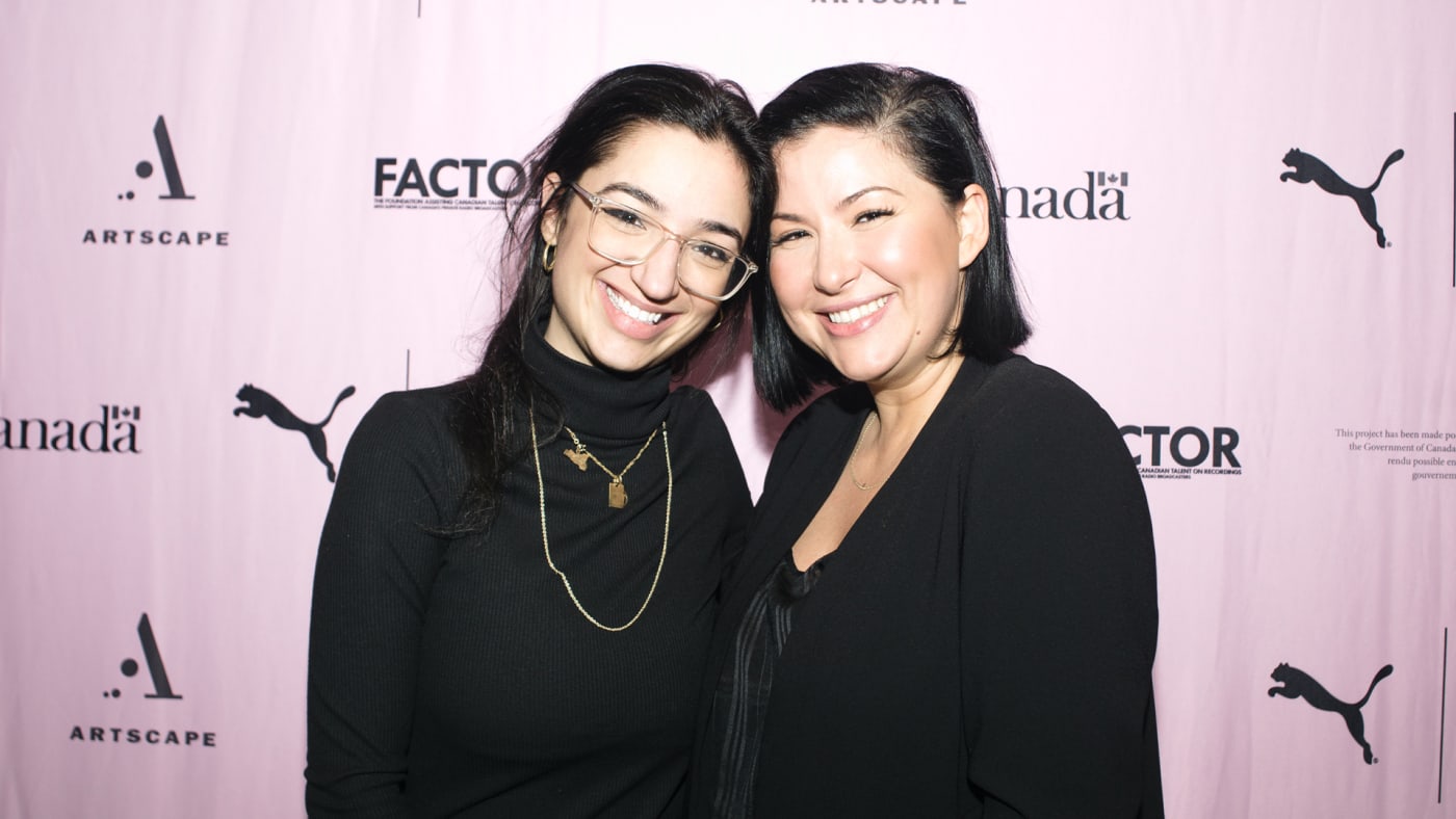 Girl Connected founders smiling wearing black