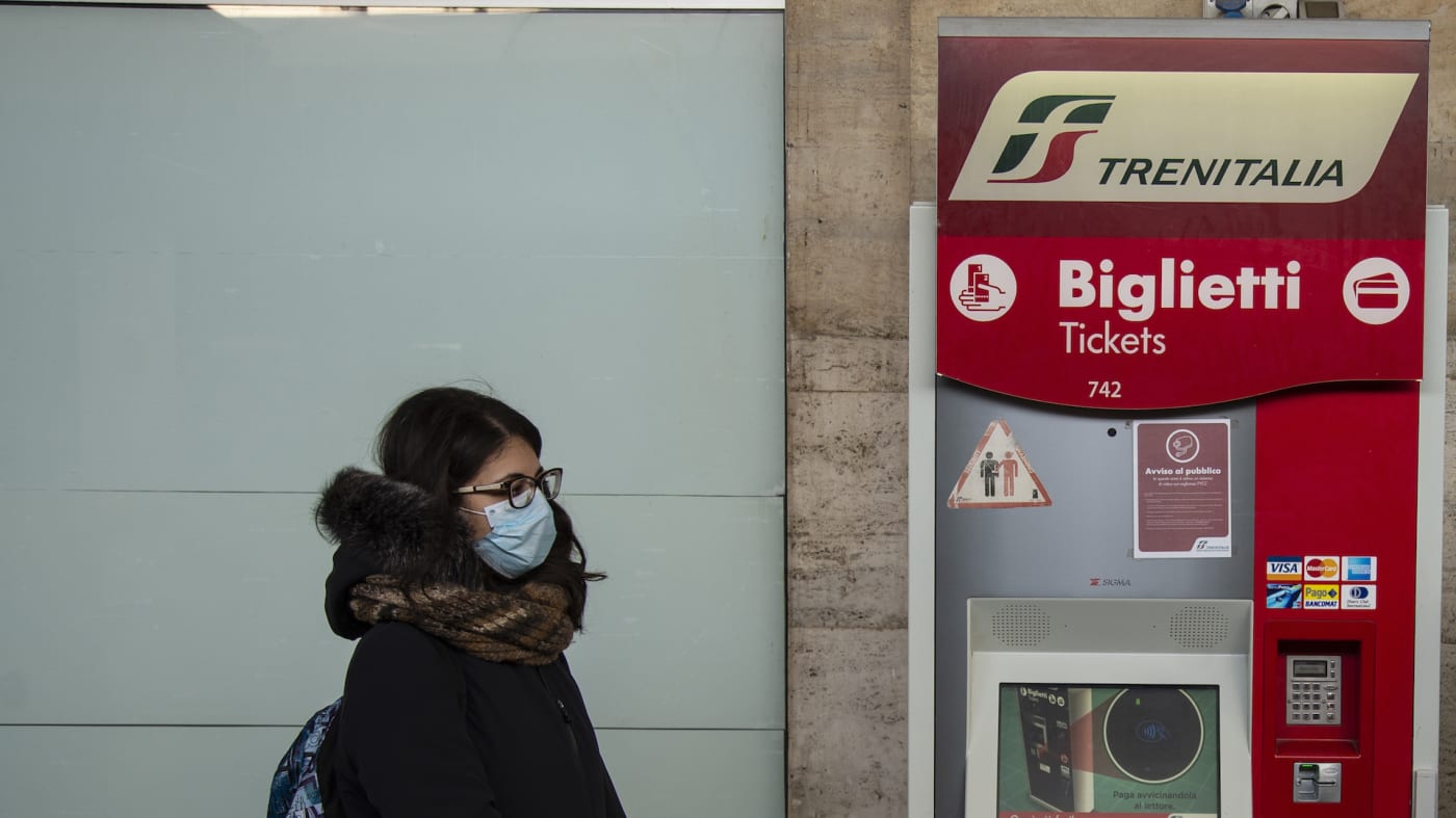 Train passenger with masks during sanitary checks on March 08, 2020
