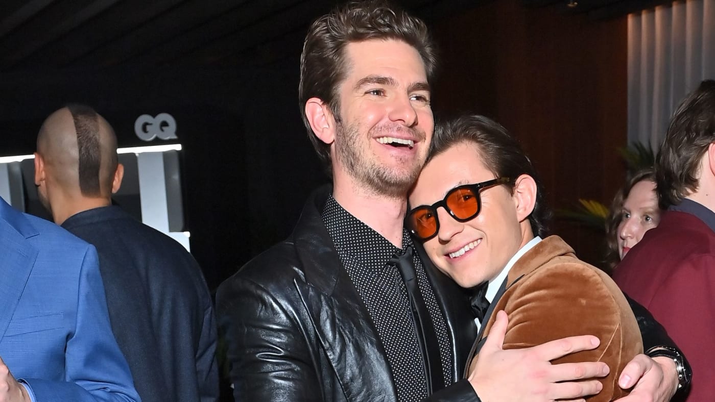 Tom Holland and Andrew Garfield embrace at a GQ event