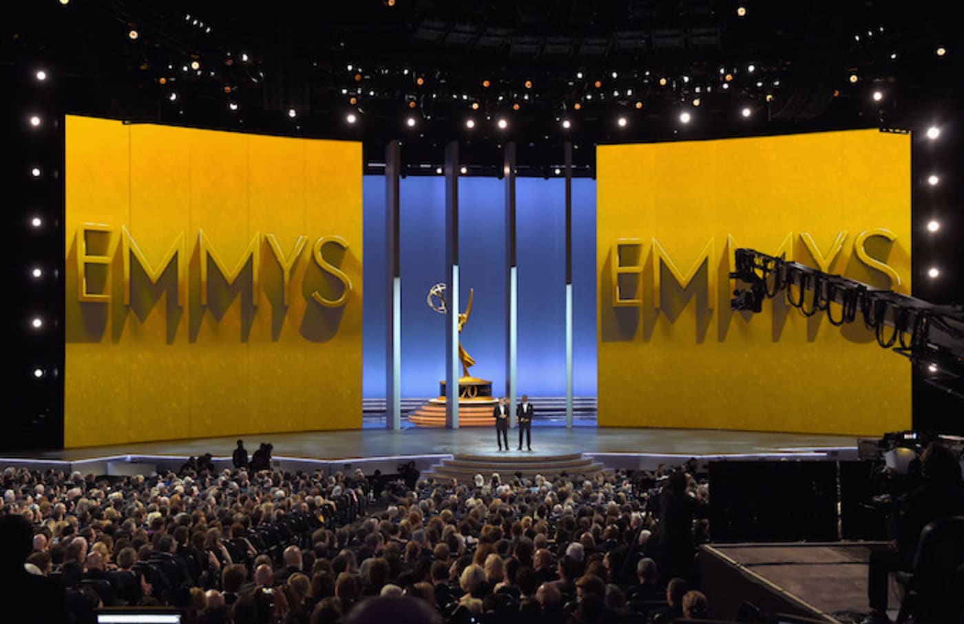 Colin Jost (L) and Michael Che speak onstage during the 70th Emmy Awards.