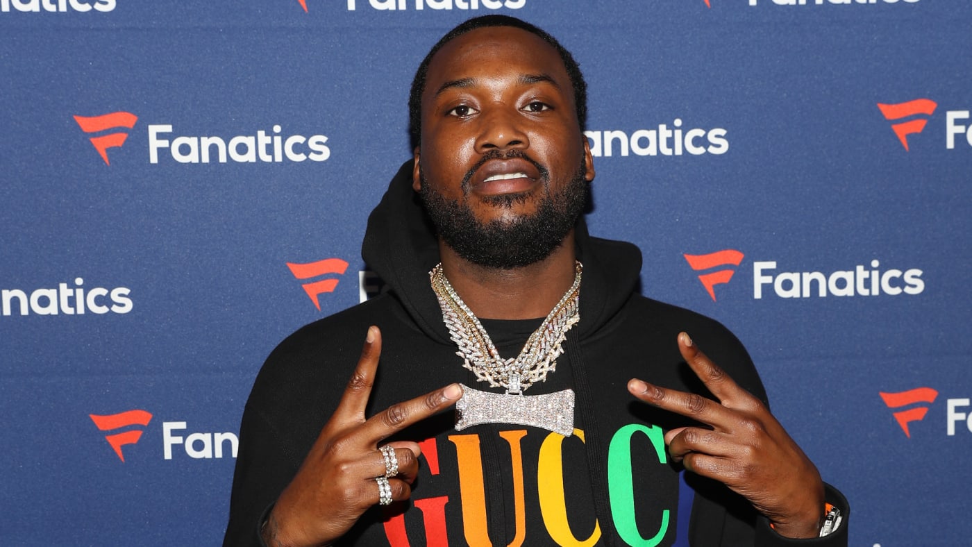 Meek Mill poses for photos during red carpet event.