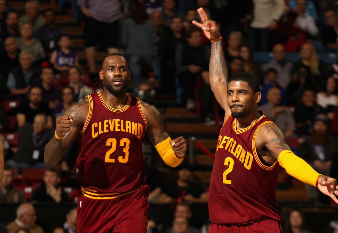 LeBron James and Kyrie Irving celebrate a big play.